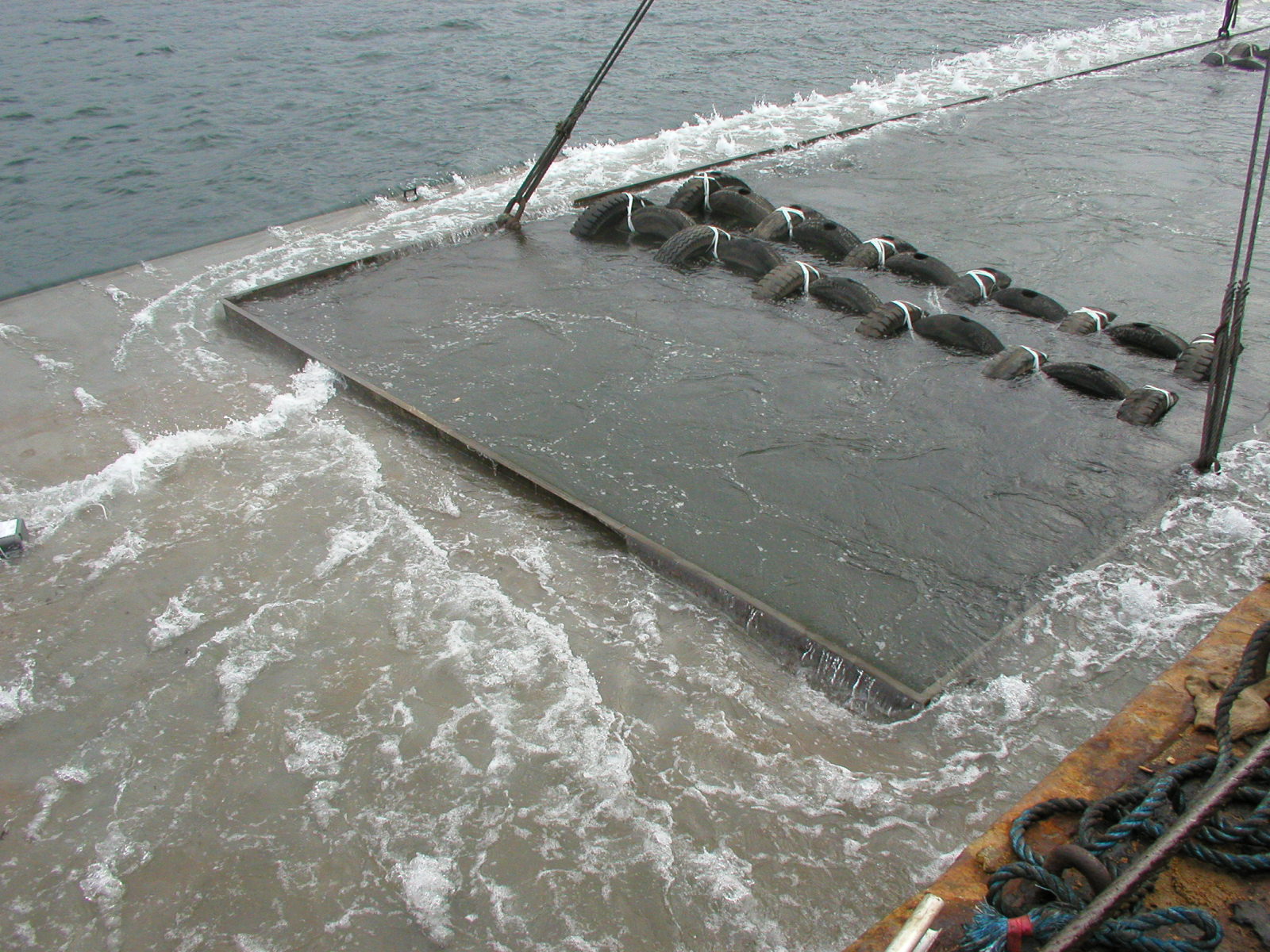 Photo of deployment of steel vessel artificial reef at Outer port shelter