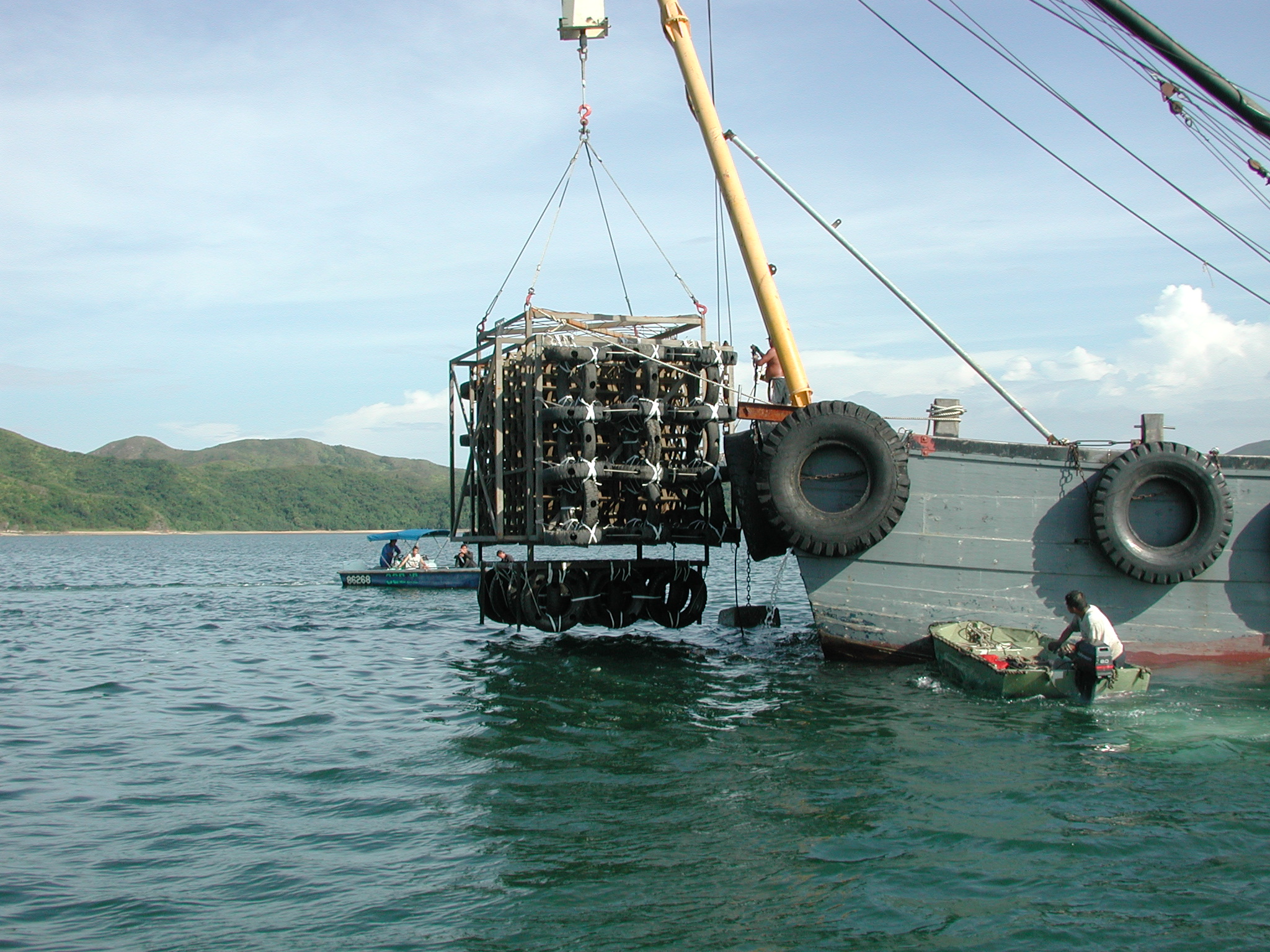 Photo of deployment of used tyre artificial reef