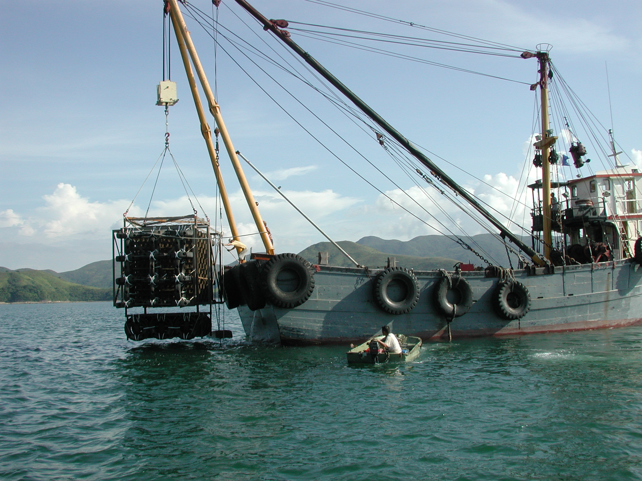 Photo of deployment of used tyre artificial reef