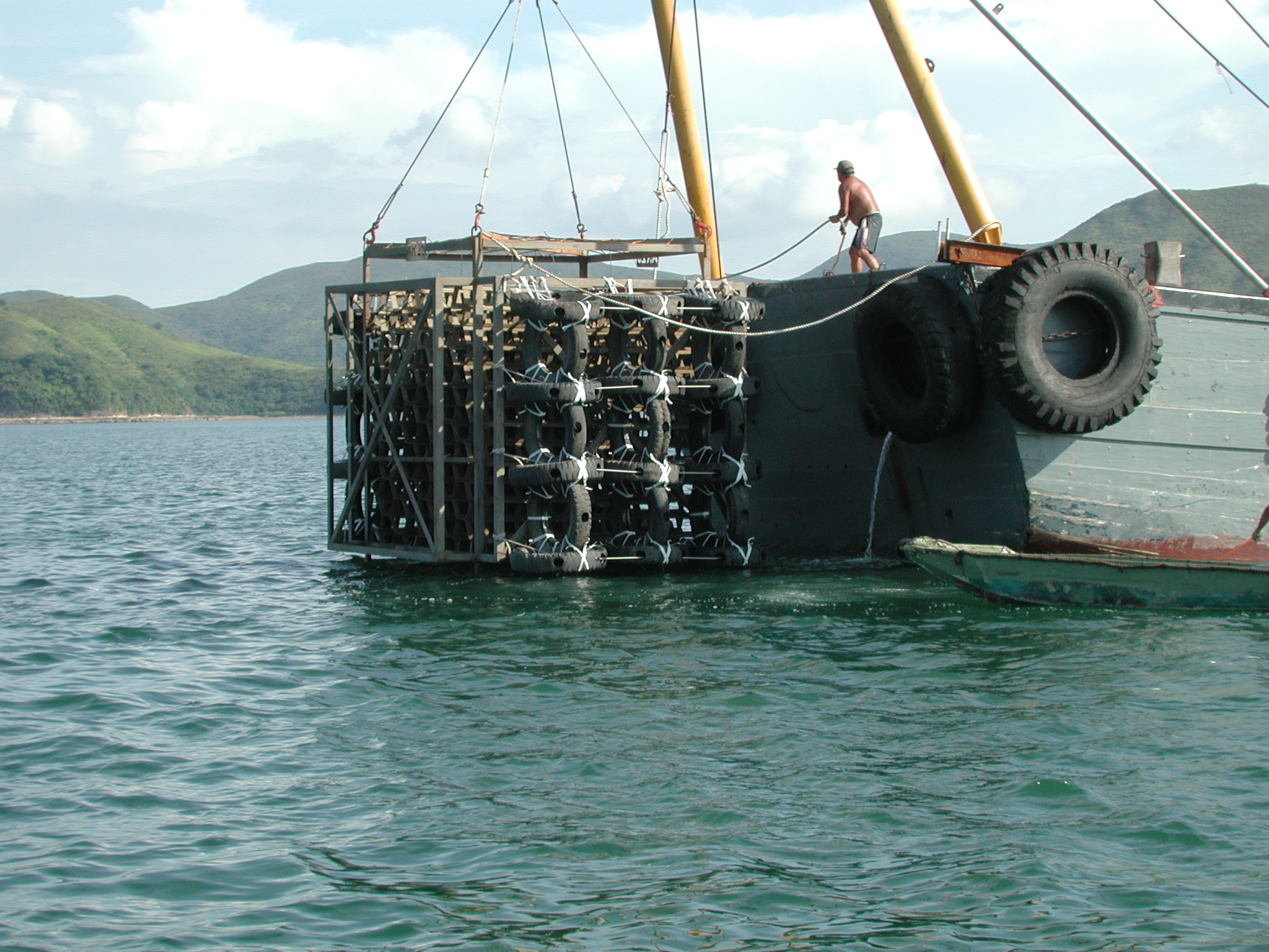 Photo of deployment of used tyre artificial reef